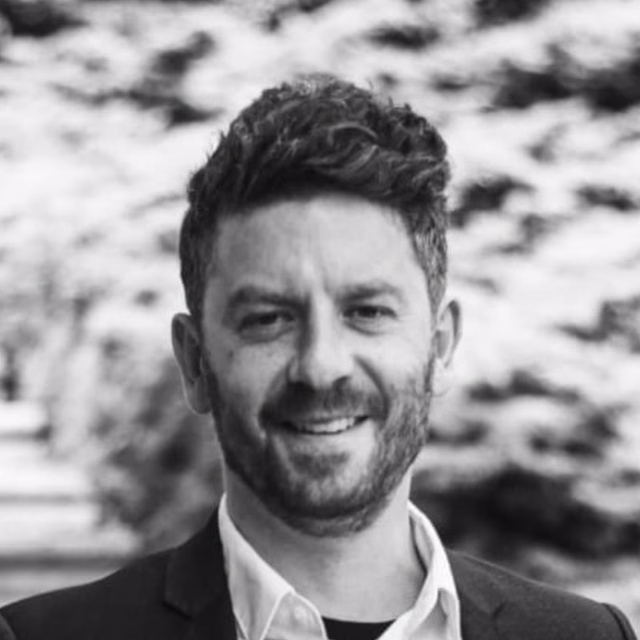 Headshot of Sach Baylin-Stern.